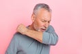 Photo of unhealthy upset man pensioner dressed grey shirt coughing isolated pink color background