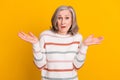 Photo of unsure white hairdo elder lady hands up wear sweater isolated on yellow color background