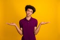 Photo of upset disappointed guy wear violet trendy clothes showing gesture no answer excuse me isolated on yellow color Royalty Free Stock Photo