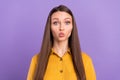 Photo of valentine young lady blow kiss wear yellow shirt isolated on vivid violet color background