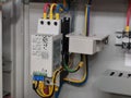 Photo of variable speed drive device in electrical cabinet.