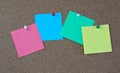 Photo of various colorful papers with space for text pinned with colorful pins on a note board Royalty Free Stock Photo