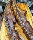 photo of veal cutlets done on the grill whole and then divided with a knife