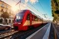 Photo of a vibrant red and white train or tram speeding down train tracks in the city Royalty Free Stock Photo