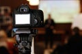 Photo video camera with empty white screen in audience recordin Royalty Free Stock Photo