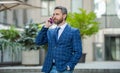 photo view of businessman call on phone and talk. businessman has phone call outdoor