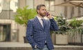 photo view of businessman call on phone and talk. businessman has phone call outdoor