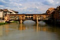 View of the Ponte Vecchio arch bridge with houses across the Arno river in Florence, Italy Royalty Free Stock Photo