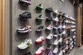 Minsk, Belarus - Nov 25, 2021: Photo of a view of a wall of sneakers inside the sports shop of shoes