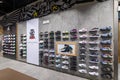 Minsk, Belarus - Nov 25, 2021: Photo of a view of a wall of sneakers inside the sports shop of shoes