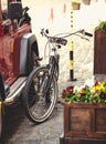 Photo of vintage bike hitched to car with chain