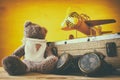 Photo of vintage toy plane and cute teddy bear Royalty Free Stock Photo