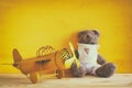 Photo of vintage toy plane and cute teddy bear Royalty Free Stock Photo