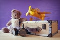 Photo of vintage toy plane and cute teddy bear Royalty Free Stock Photo