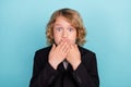 Photo of voiceless small blond boy close mouth wear uniform on blue color background