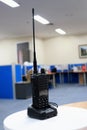 Photo of the walky talky sitting on a security guard\'s desk, this tool is for short distance communication