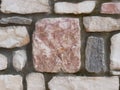 Photo A wall built of square and rectangular marble pieces of different sizes and cement. Royalty Free Stock Photo