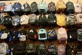 Photo of a wall full of colorful designer School Backpacks
