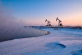 The oil sucking machine sunrise in winter Royalty Free Stock Photo