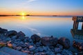 The sun setting lakeside Royalty Free Stock Photo