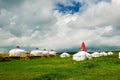 The white mongolia yurts on the green steppe