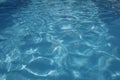 Photo of water in swimming pool, surface of blue pool, ripple vacuity in pool, sun reflection in basin, clear light blue pool Royalty Free Stock Photo