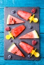 Photo of watermelon slices , fruit ice, blueberries on cutting board Royalty Free Stock Photo