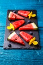 Photo of watermelon slices , fruit ice, blueberries on cutting board Royalty Free Stock Photo