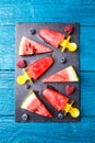 Photo of watermelon slices , fruit ice, blueberries on cutting board Royalty Free Stock Photo