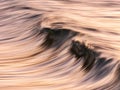 Photo of a wave at sunset with panning technique Royalty Free Stock Photo