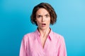 Photo of wavy shocked surprised woman worker dressed pink shirt open mouth raised eyebrow isolated blue color background