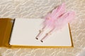 Photo of a wedding register and feather pen. Wedding guestbook. Royalty Free Stock Photo