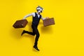 Photo of weird crazy guy racoon mask jump run hurry hold vintage bags wear stylish look isolated over shine yellow color Royalty Free Stock Photo