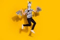 Photo of weird lucky guy dressed wild animal costume shopaholic jumping high isolated yellow color background