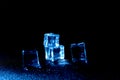 Photo of 5 wet artificial or Blue fake ice cube at Black background