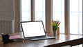 Photo of white blank screen computer putting on wooden table. Royalty Free Stock Photo