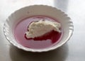 White bowl, cranberry jelly with cottage cheese cream, school feeding concept, lunch for students