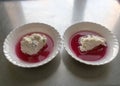 White bowl, cranberry jelly with cottage cheese cream, school feeding concept, lunch for students