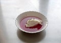 White bowl, cranberry jelly with cottage cheese cream, school feeding concept, lunch for students