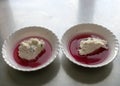 White bowl, cranberry jelly with cottage cheese cream, school feeding concept, lunch for students