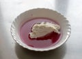 White bowl, cranberry jelly with cottage cheese cream, school feeding concept, lunch for students