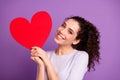 Photo of white cheerful cute nice lovely girlish feminine youngster holding valentine postcard red heart big smiling