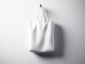 Photo white cotton textile bag hanging center. Empty abstract wall background. Highly detailed texture, space for