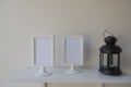 Photo White Frame on a wooden and Lantern on wall background .