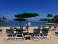 Relaxing on white sandy beach on comfortable lazy chair during the sunny day. Royalty Free Stock Photo