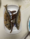 Photo of whole fried or grilled mackerel or oily fish