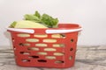 Photo of a wire shopping basket full of fresh fruit and vegetables, isolated on a white background Royalty Free Stock Photo