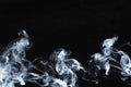 Photo of a wisp of smoke on a dark background