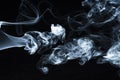 Photo of a wisp of smoke on a dark background