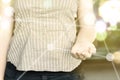 Photo of woman focusing in her opened hand on a sunny day